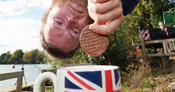 man dipping biscuit in mug