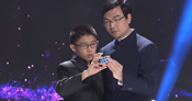 two people doing rubiks cube