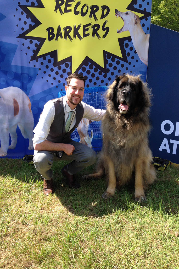 Adam Millward posing with big dog