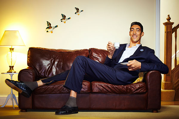 sultan in suit sitting on A sofa
